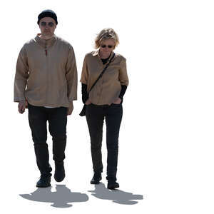 two cut out backlit people walking