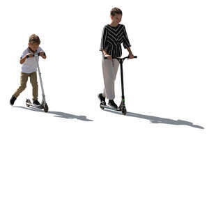 two backlit children riding scooters