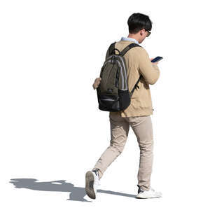 cut out asian man walking and checking his phone