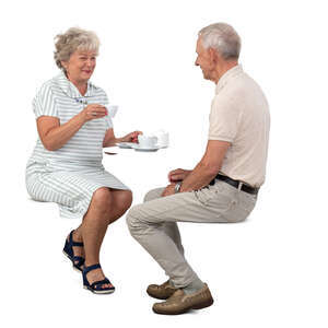cut out elderly couple sitting in a cafe and drinking coffee