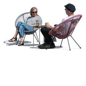 two people sitting in an outdoor cafe