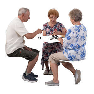 cut out group of three senior people sitting and playing domino