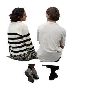 cut out man and woman sitting seen from back angle