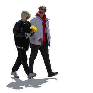 cut out backlit man and woman walking and holding flowers