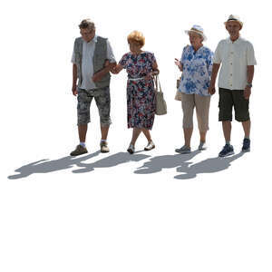 two backlit elderly couples walking