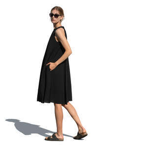 cut out woman in a black dress standing and looking back over the shoulder