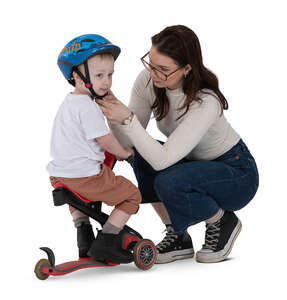 cut out woman squatting and putting a helmet on her son