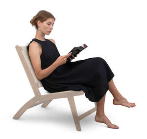 cut out woman in a black dress sitting and reading