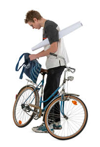 young man packing thing to go ride a bike