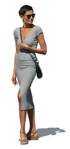 woman in a grey bodycon dress standing