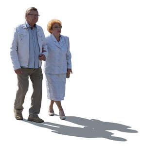 cut out backlit elderly couple walking arm in arm