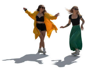 two backlit women dancing