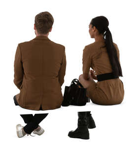 two people in brown colour outfits sitting