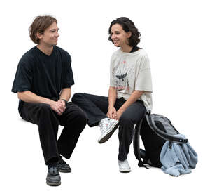 two people sitting and talking