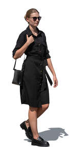 woman in a black shirt dress walking