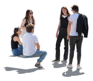 group of people sitting and standing