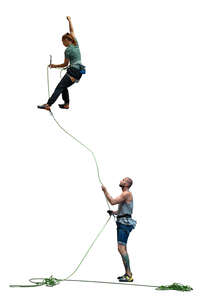 rock climbing team climbing on a climbing wall