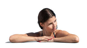 woman leaning on the edge of the swimming pool