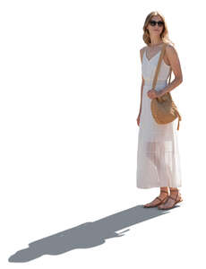 cut out backlit woman in a white summer dress standing