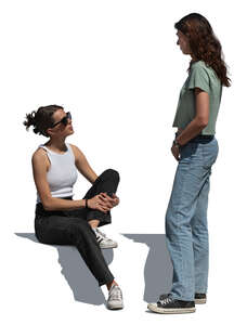 woman standing and talking to her friend