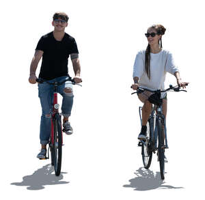 two backlit people riding bikes