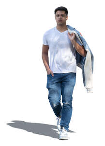 young man walking in partial sunlight