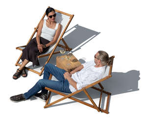 top view of a couple relaxing in sling chairs outside