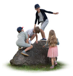 children climbing on a big rock