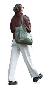 woman in white trousers walking