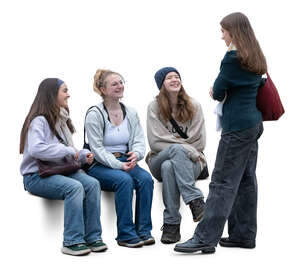 group of young women sitting and talking