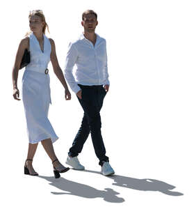 elegant backlit couple walking in summer