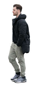 young man with a winter jacket walking