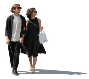 cut out sidelit couple walking