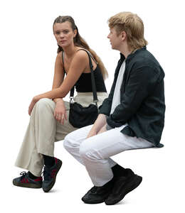 two people sitting and talking