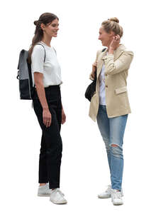 two women standing and talking