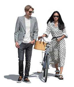 two people with a bicycle walking