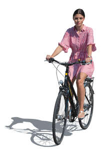 cut out woman in a summer dress riding a bike