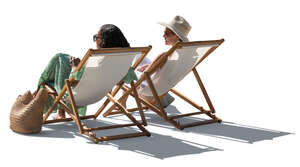 two women sitting in sling chairs and talking