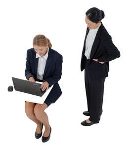 two businesswoman working with computer seen from above