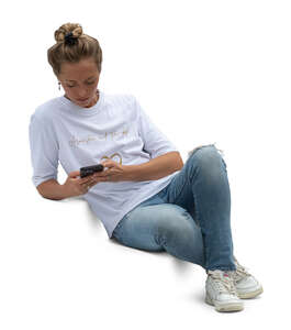 cut out woman sitting on the stairs and looking at her phone