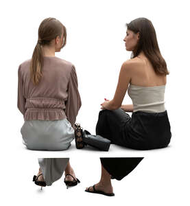 two chic women sitting and talking