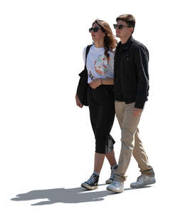 cut out backlit couple walking in the street