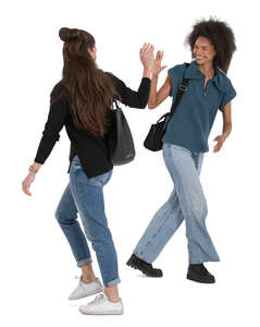 two women walking ad saying goodbye in the street