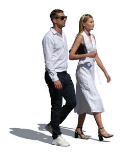 chic young couple in white walking in summer