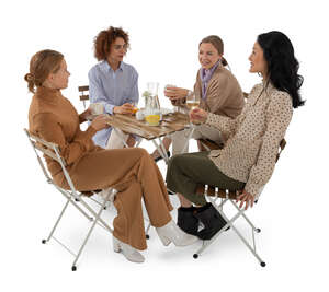 group of women sitting in a cafe and talking