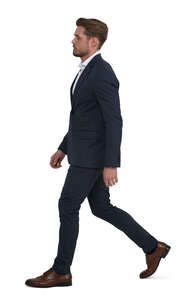 man in a dark suit walking