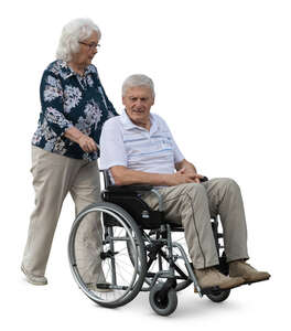 cut out elderly woman pushing a man sitting in a wheelchair