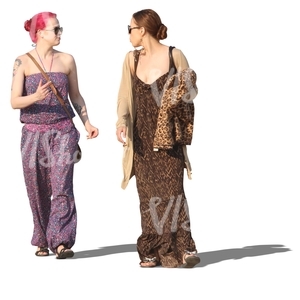 two women in summer dresses walking and talking