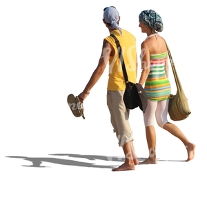 couple walking barefoot on the beach