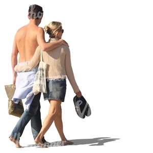 couple walking barefoot arm in arm